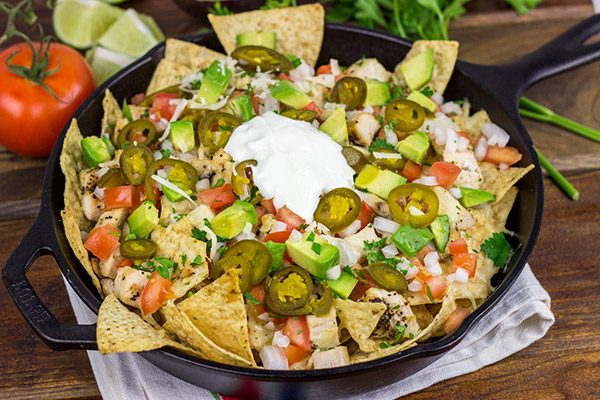 These Cast Iron Skillet Nachos are the perfect snack to serve while watching buzzer beaters in the NCAA Tourney!