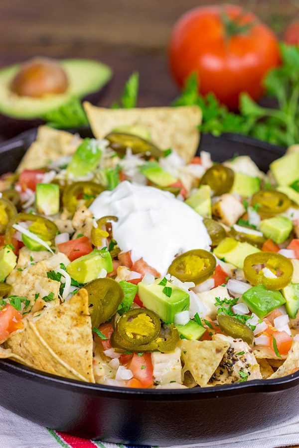 These Cast Iron Skillet Nachos are the perfect snack to serve while watching buzzer beaters in the NCAA Tourney!