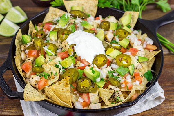 These Cast Iron Skillet Nachos are the perfect snack to serve while watching buzzer beaters in the NCAA Tourney!