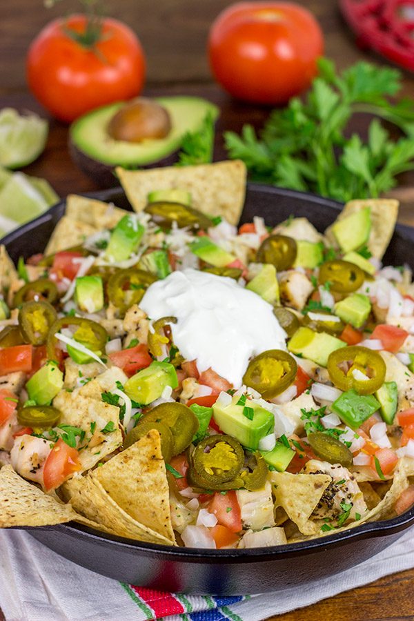 These Cast Iron Skillet Nachos are the perfect snack to serve while watching buzzer beaters in the NCAA Tourney!