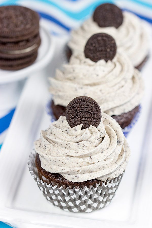 A moist chocolate cake and a cookies 'n' cream frosting combine to create these tasty Oreo Cupcakes!