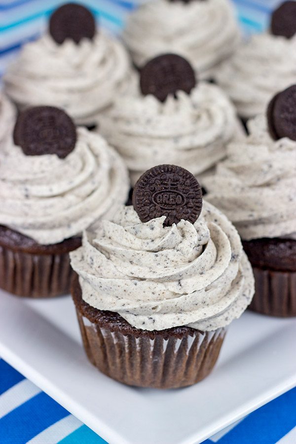 A moist chocolate cake and a cookies 'n' cream frosting combine to create these tasty Oreo Cupcakes!