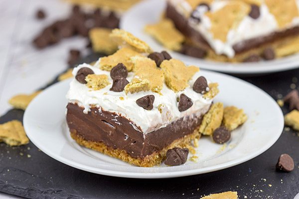 Celebrate warm summer days with this twist on a classic.  These Frozen S'mores Bars are sure to be a hit in your family!