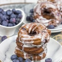 These Glazed Blueberry Crullers are a twisted cake donut filled with blueberries and drizzled with a classic glaze...and they're delicious!