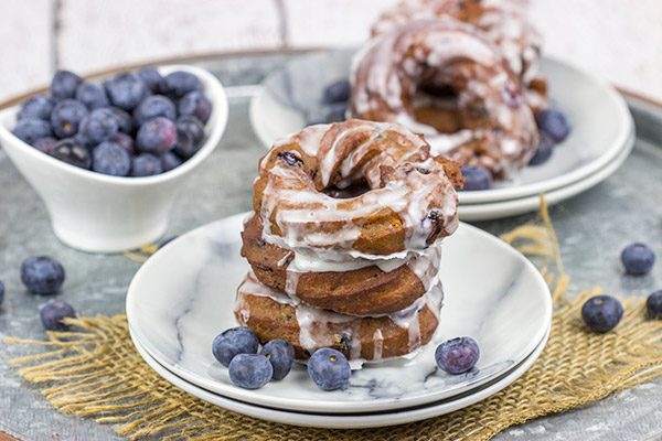 These Glazed Blueberry Crullers are a twisted cake donut filled with blueberries and drizzled with a classic glaze...and they're delicious!