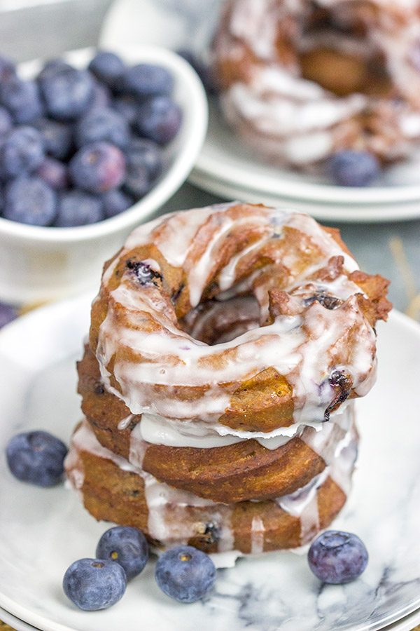 These Glazed Blueberry Crullers are a twisted cake donut filled with blueberries and drizzled with a classic glaze...and they're delicious!