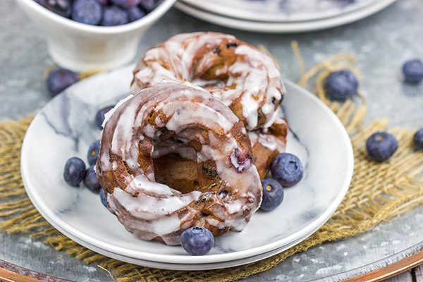 These Glazed Blueberry Crullers are a twisted cake donut filled with blueberries and drizzled with a classic glaze...and they're delicious!