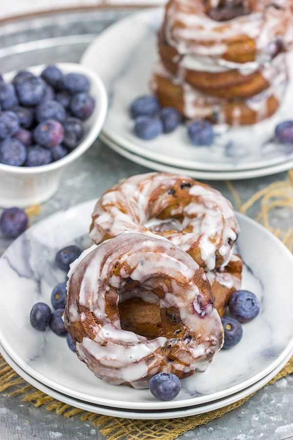 These Glazed Blueberry Crullers are a twisted cake donut filled with blueberries and drizzled with a classic glaze...and they're delicious!