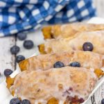 Filled with fresh blueberries and a hint of lemon zest, these Glazed Blueberry Hand Pies are the perfect dessert for warm summer days!