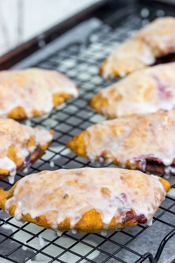 Filled with fresh blueberries and a hint of lemon zest, these Glazed Blueberry Hand Pies are the perfect dessert for warm summer days!