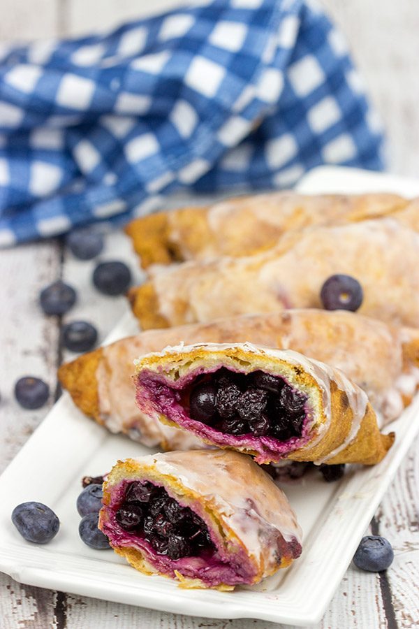 Filled with fresh blueberries and a hint of lemon zest, these Glazed Blueberry Hand Pies are the perfect dessert for warm summer days!