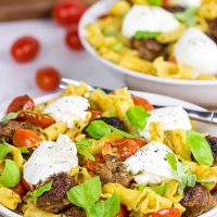Time to mix up pasta night! This Sausage and Basil Campanelle with Burrata is a delicious weeknight dinner idea!