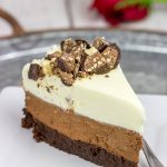 This Triple Chocolate Mousse Cake features 3 layers of chocolate, and it's topped with chopped Baci Perugina chocolate. This cake is perfect for any and all chocolate lovers in your life!
