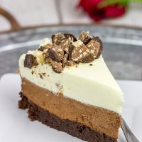 This Triple Chocolate Mousse Cake features 3 layers of chocolate, and it's topped with chopped Baci Perugina chocolate. This cake is perfect for any and all chocolate lovers in your life!