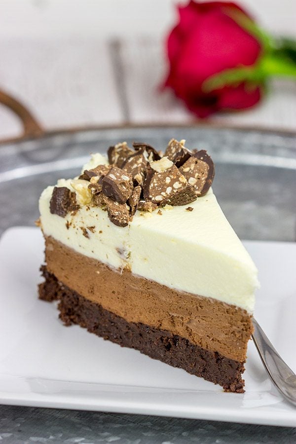 This Triple Chocolate Mousse Cake features 3 layers of chocolate, and it's topped with chopped Baci Perugina chocolate. This cake is perfect for any and all chocolate lovers in your life!