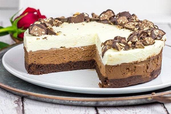 This Triple Chocolate Mousse Cake features 3 layers of chocolate, and it's topped with chopped Baci Perugina chocolate. This cake is perfect for any and all chocolate lovers in your life!