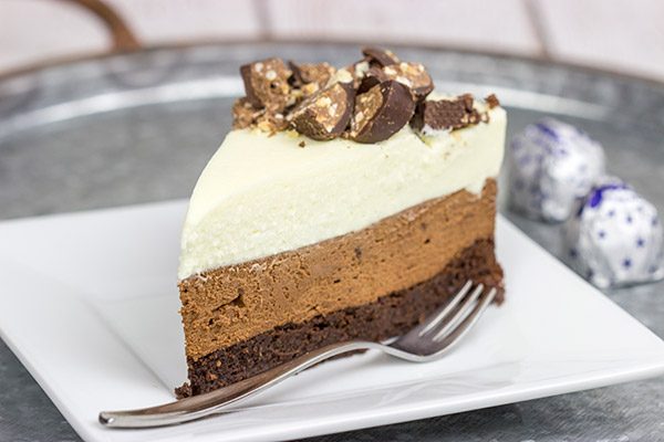 This Triple Chocolate Mousse Cake features 3 layers of chocolate, and it's topped with chopped Baci Perugina chocolate. This cake is perfect for any and all chocolate lovers in your life!