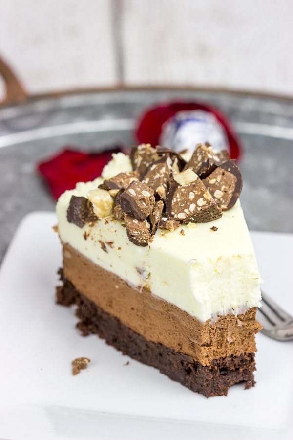 This Triple Chocolate Mousse Cake features 3 layers of chocolate, and it's topped with chopped Baci Perugina chocolate. This cake is perfect for any and all chocolate lovers in your life!