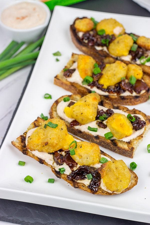 These Bacon and Cheddar Cheese Curd Bites make for a delicious appetizer...especially while watching sports!  And the smoky ranch dressing?  It's tasty enough to be a dip all by itself!
