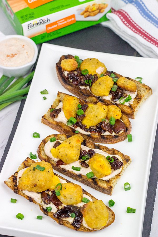 These Bacon and Cheddar Cheese Curd Bites make for a delicious appetizer...especially while watching sports!  And the smoky ranch dressing?  It's tasty enough to be a dip all by itself!