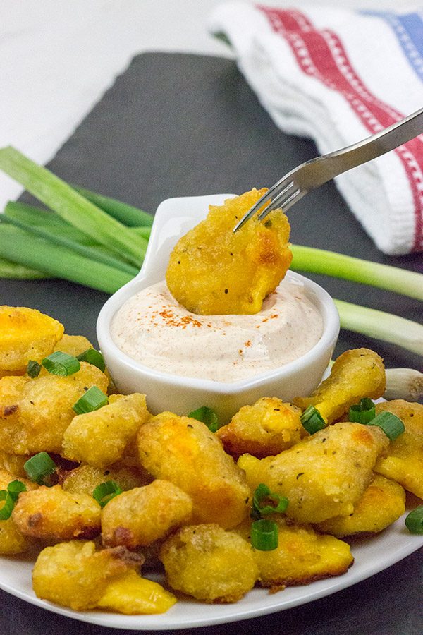 These Bacon and Cheddar Cheese Curd Bites make for a delicious appetizer...especially while watching sports!  And the smoky ranch dressing?  It's tasty enough to be a dip all by itself!