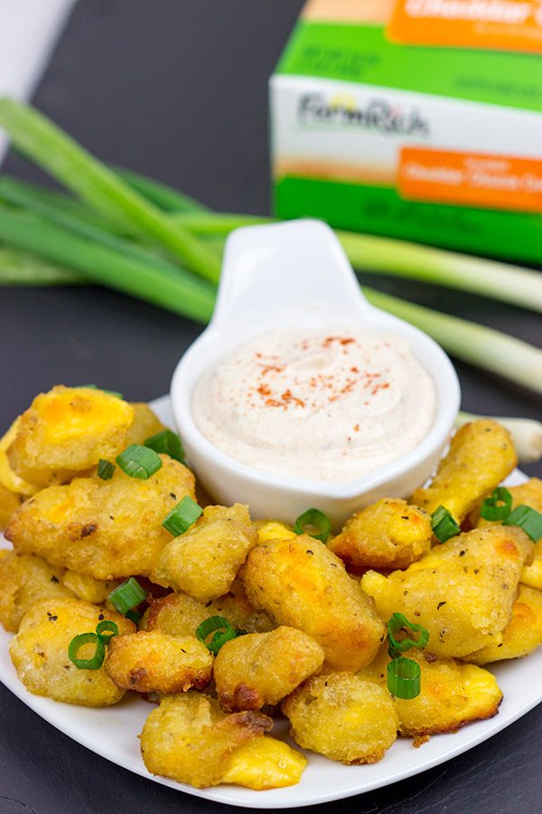 These Bacon and Cheddar Cheese Curd Bites make for a delicious appetizer...especially while watching sports!  And the smoky ranch dressing?  It's tasty enough to be a dip all by itself!