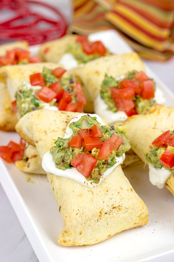 These Baked Chicken Chimichangas are a baked version of classic TexMex fare...and they're really delicious! Consider making a batch of these for your next party!