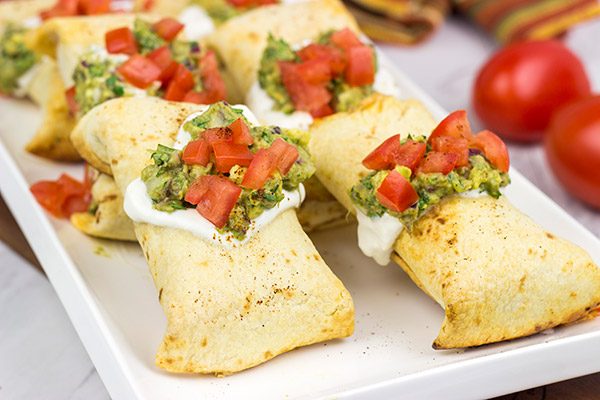These Baked Chicken Chimichangas are a baked version of classic TexMex fare...and they're really delicious!  Consider making a batch of these for your next party!