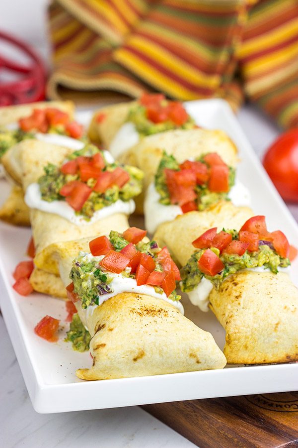 These Baked Chicken Chimichangas are a baked version of classic TexMex fare...and they're really delicious!  Consider making a batch of these for your next party!