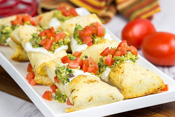 These Baked Chicken Chimichangas are a baked version of classic TexMex fare...and they're really delicious!  Consider making a batch of these for your next party!