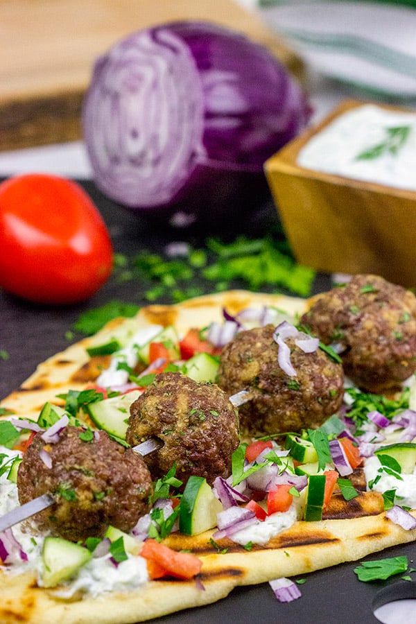 These Mediterranean Meatball Kabobs deserve a spot on your dinner menu soon! Served up with grilled naan and a bit of tzatziki sauce, these meatballs are sure to become a favorite in your house, too!