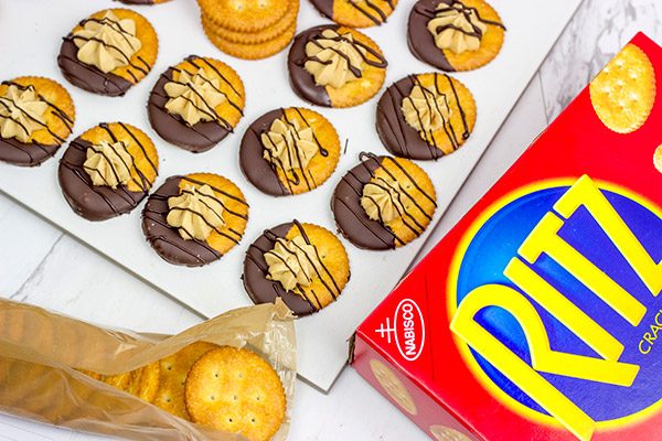 Looking for a fun entertaining idea? Grab a pack of RITZ and whip up these No Bake Chocolate Peanut Butter Pie RITZ Crackers!