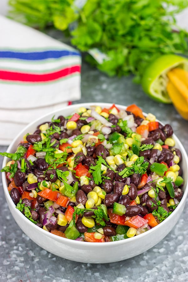 This Easy Black Bean Salad is a summer staple in our house.  It's delicious as either a side dish with grilled food or as a dip with tortilla chips!