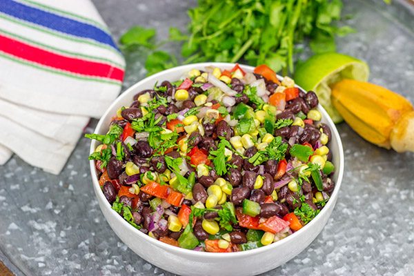 This Easy Black Bean Salad is a summer staple in our house.  It's delicious as either a side dish with grilled food or as a dip with tortilla chips!