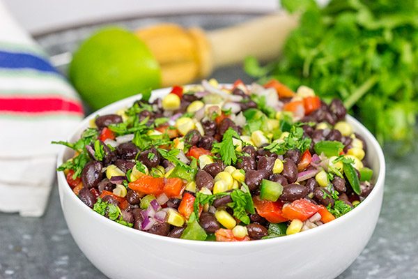 This Easy Black Bean Salad is a summer staple in our house. It's delicious as either a side dish with grilled food or as a dip with tortilla chips!