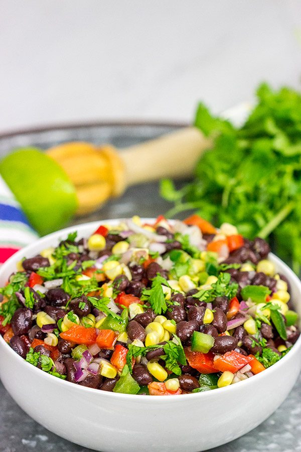This Easy Black Bean Salad is a summer staple in our house. It's delicious as either a side dish with grilled food or as a dip with tortilla chips!