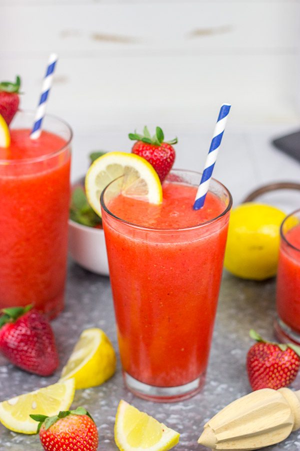 Made from just 3 ingredients, this Frozen Strawberry Lemonade is the perfect way to cool off when it's hotter'n blue blazes outside your door!