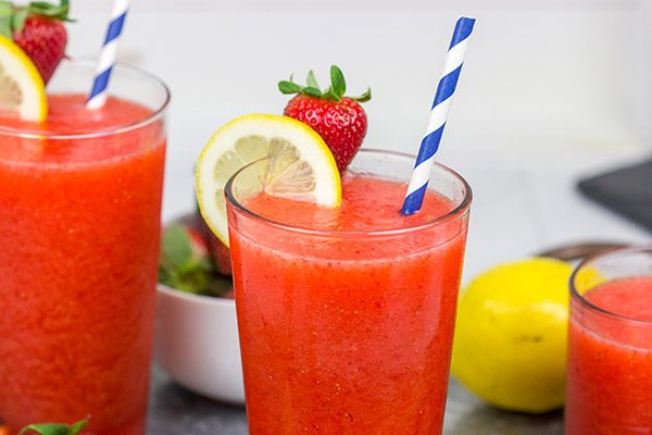 Made from just 3 ingredients, this Frozen Strawberry Lemonade is the perfect way to cool off when it's hotter'n blue blazes outside your door!