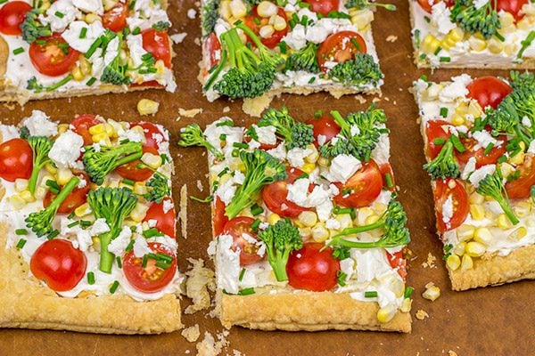 Got some extra veggies in the garden?  Whip up this easy Garden Vegetable Tart!  This tart is the perfect snack on a warm summer evening!