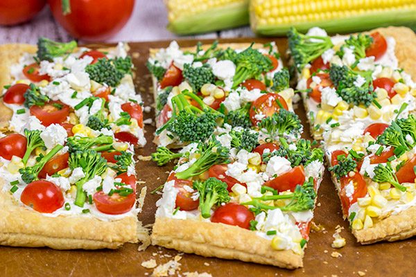 Got some extra veggies in the garden?  Whip up this easy Garden Vegetable Tart!  This tart is the perfect snack on a warm summer evening!