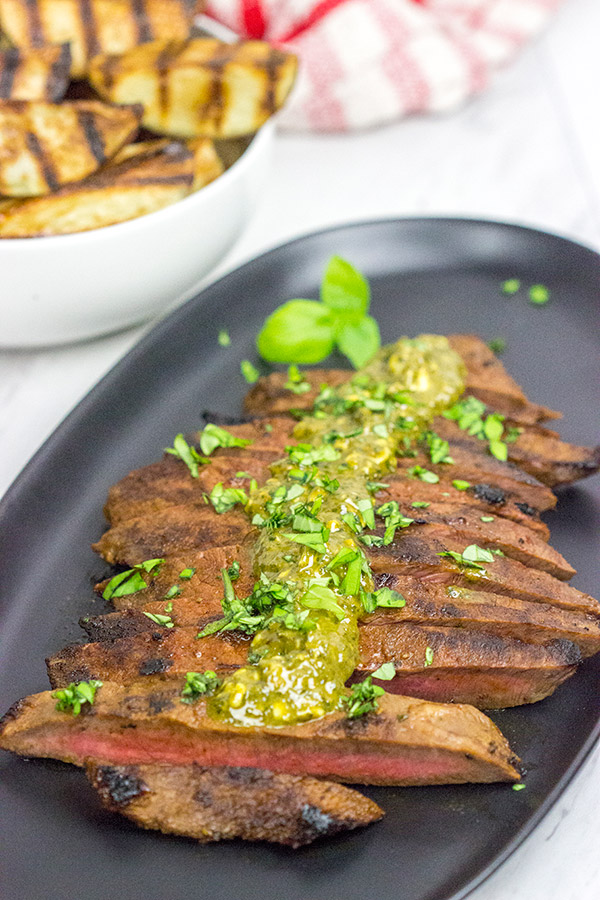 The flat iron steak is the 2nd most tender cut of beef behind only a tenderloin (aka "filet mignon").  Give the flat iron cut a shot with this Marinated Flat Iron Steak with Pesto Butter recipe!