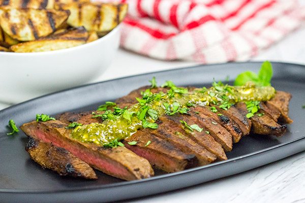 The flat iron steak is the 2nd most tender cut of beef behind only a tenderloin (aka "filet mignon").  Give the flat iron cut a shot with this Marinated Flat Iron Steak with Pesto Butter recipe!