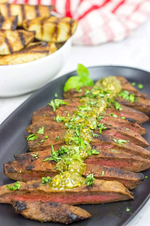 The flat iron steak is the 2nd most tender cut of beef behind only a tenderloin (aka "filet mignon").  Give the flat iron cut a shot with this Marinated Flat Iron Steak with Pesto Butter recipe!