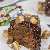 This Milky Way Bundt Cake features Milky Way candy bars baked in the cake and sprinkled on top. It's the perfect dessert for the chocolate lover in your life!