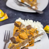 Featuring chopped Butterfinger bars both in and on top, this frozen No Bake Butterfinger Pie is a tasty dessert for a hot summer day!