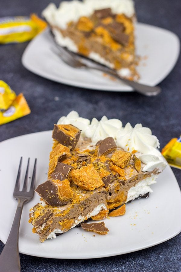 Featuring chopped Butterfinger bars both in and on top, this frozen No Bake Butterfinger Pie is a tasty dessert for a hot summer day!