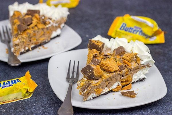 Featuring chopped Butterfinger bars both in and on top, this frozen No Bake Butterfinger Pie is a tasty dessert for a hot summer day!