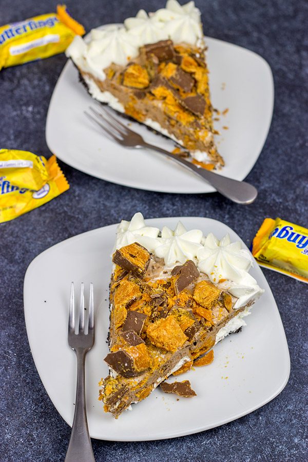 Featuring chopped Butterfinger bars both in and on top, this frozen No Bake Butterfinger Pie is a tasty dessert for a hot summer day!