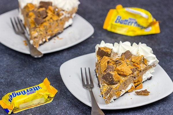 Featuring chopped Butterfinger bars both in and on top, this frozen No Bake Butterfinger Pie is a tasty dessert for a hot summer day!