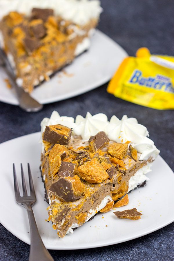 Featuring chopped Butterfinger bars both in and on top, this frozen No Bake Butterfinger Pie is a tasty dessert for a hot summer day!